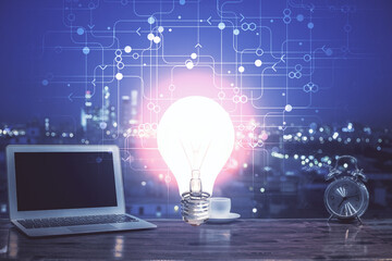 Poster - Computer on desktop in office with bulb icon hologram. Multi exposure. Concept of idea.