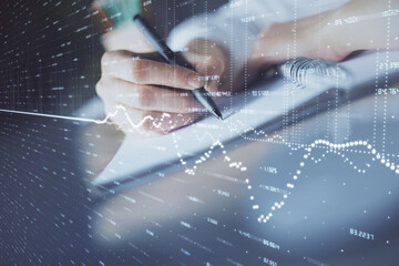 Poster - Financial forex graph displayed on hands taking notes background. Concept of research. Double exposure