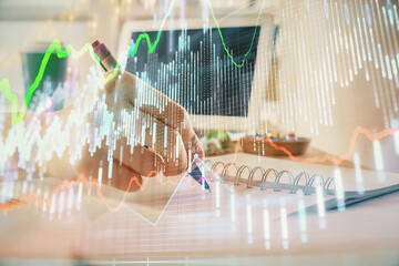 Poster - financial forex graph drawn over hands taking notes background. concept of research. multi exposure