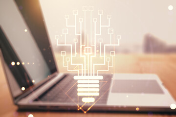 Creative idea concept with light bulb and microcircuit illustration on modern laptop background. Neural networks and machine learning concept. Multiexposure