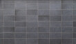 © tuomaslehtinen - Front view of a wall made of gray slabs. Abstract full frame background of a new and modern wall or building exterior made of grey slabs.
