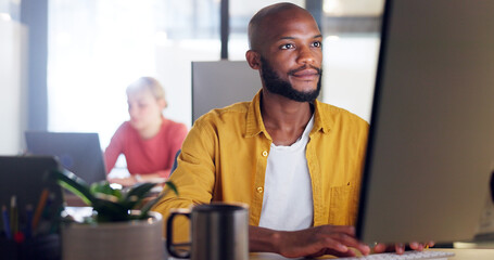 Canvas Print - Office, computer and laptop of businessman with information technology, company software or website management for innovation. Desktop, multimedia technology of IT black man working on digital update