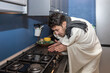 © Vitaliy - Freezing couple warming close to gas oven. Cold winter and high price taxes concept