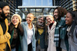 © CarlosBarquero - Business team working smiling portrait, talking and laughing. Man and women outdoors together in modern office celebrate success at work company. High quality photo