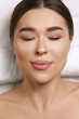 © verona_studio - .Beautiful girl lies on a massage table. Spa skin and body care. Facial beauty treatment.Cosmetology.