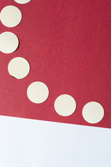 Wall Mural - simple cardboard circles on red scrapbook paper with texture