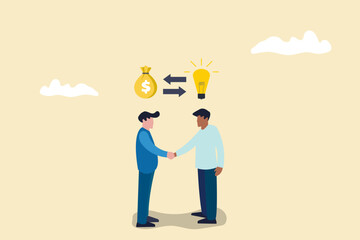 Business negotiation, deal making or acquisition, merger and Buying a good idea concept. Two men shaking hands.