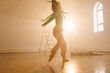 © Wavebreak Media - Image of biracial female modern dancer dancing in smoked interior