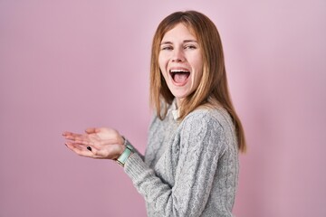 Sticker - Beautiful woman standing over pink background pointing aside with hands open palms showing copy space, presenting advertisement smiling excited happy