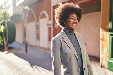 African american woman executive smiling confident standing at street