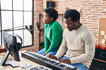 Poster - African american man and woman music group singing song playing keyboard piano at music studio