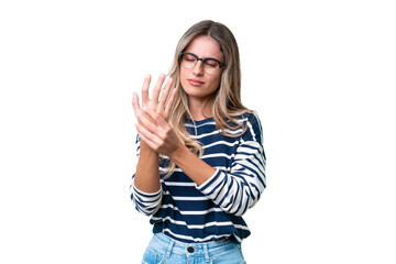 Wall Mural - Young Uruguayan woman over isolated background suffering from pain in hands