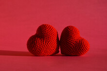 Valentine's Day. Holiday Of Lovers, Love. Viva Magenta. Background For The Design. Two Knitted Hearts.