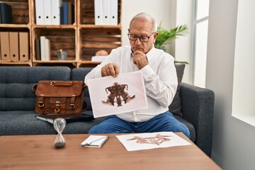 Canvas Print - Senior man psychologist smiling confident having rorscharch test session at psychology center