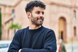 © Krakenimages.com - Young arab man smiling confident standing with arms crossed gesture at street