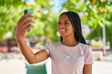 Poster - African american woman smiling confident making selfie by the smartphone at park