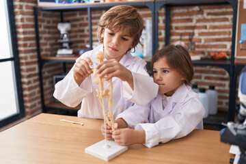 Sticker - Brother and sister students having anatomy lesson at laboratory classroom