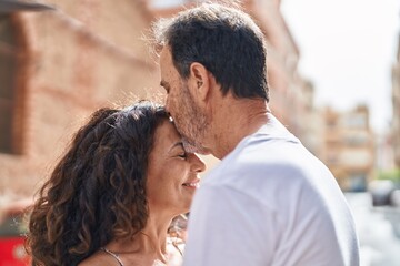 Sticker - Man and woman couple hugging each other kissing at street