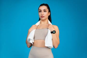 Wall Mural - Attractive athletic woman with towel on her neck