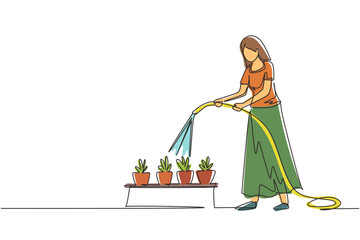 Poster - Continuous one line drawing young woman watering potted plants with hose. Gardening, greenhouse, botanical garden, flowers growing, plant nursery concept. Single line draw design vector illustration