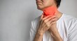 Redness at neck of Asian man. Concept of sore throat, pharyngitis, laryngitis, thyroiditis, choking or dysphagia.