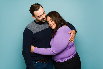 Wall Mural - Loving girlfriend in love embracing her boyfriend