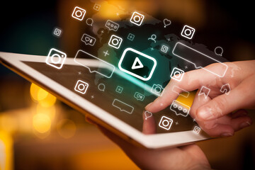 Close-up of a hand using tablet, social media concept