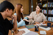 © mojo_cp - Asian student girl High School Tutor Individual Tuition From Teacher In Library. University Student Tutor books with friends.