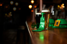 Two Beers, Hats And Costume For St. Patrick's Day At The Bar Of An Irish Pub