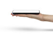 © SERSOLL - Phone in hand isolate on PNG transparent background. A modern smartphone lies on the palm with the screen up, side view, mockup for insertion into the project.