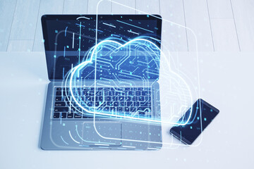 Aufkleber - Close up of laptop with cloud computing hologram on blurry office desktop background with cellphone. Data storage and server concept. Double exposure.