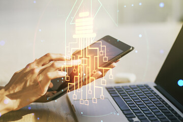 Poster - Creative light bulb with chip hologram and hand working with a digital tablet on background, artificial Intelligence and neural networks concept. Multiexposure