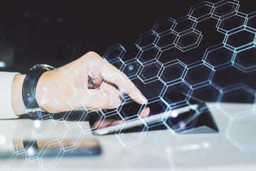 Poster - Creative concept of wireless technology with hexagon hologram and finger clicks on a digital tablet on background. Big data and database concept. Multiexposure
