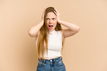 Wall Mural - Young redhead woman cut out isolated covering ears with hands trying not to hear too loud sound.