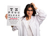 Young indian oculist woman holding an eye chart paper cut out isolated being shocked, she has remembered important meeting.