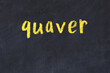 College chalk desk with the word quaver written on in