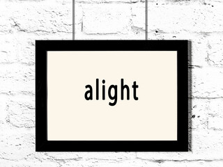 Wall Mural - Black frame hanging on white brick wall with inscription alight