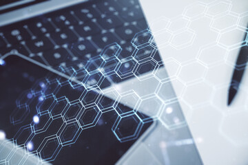 Poster - Creative concept of wireless technology with hexagon hologram on modern laptop background. Big data and database concept. Multiexposure