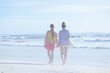 © Alliance - stylish mother and teenage daughter at beach walking