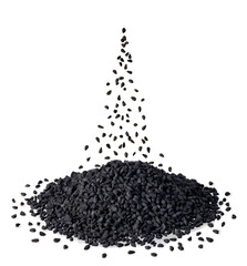 Wall Mural - black cumin seeds falling in heap isolated on white