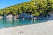 The famous pebble beach kastani with the turquoise waters where the famous Mamma Mia movie was filmed, located in Skopelos island, Sporades, Greece.