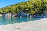 Fototapeta Do akwarium - The famous pebble beach kastani with the turquoise waters where the famous Mamma Mia movie was filmed, located in Skopelos island, Sporades, Greece.