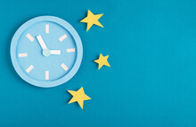 Sleep Disorder, Bedtime And Insomnia Concept. Paper Model Alarm Clock With Night Stars On Bright Blue Background. Top View, Flat Lay, Copy Space