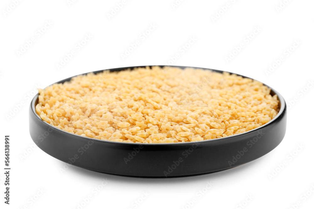 Plate of raw stelline pasta isolated on white background