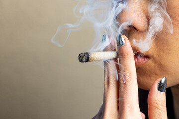 Female model smoking a joint