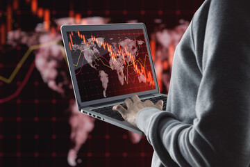 Poster - Close up of hand using laptop with falling red forex hologram on blurry background. Stock crisis price drop down chart fall 