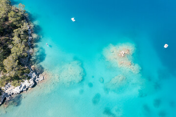Fototapete - Aerial view on the blue lagoon with rocky coast, Turkey. Travel on sea board in sunny day. Beautiful coastline and sea near Oludeniz.  