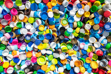 Colorful plastic caps lay on the floor.