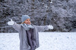 © Westend61 - Cheerful girl in warm clothing enjoying snow