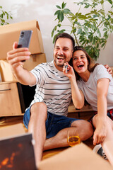 Couple taking a selfie in their new apartment